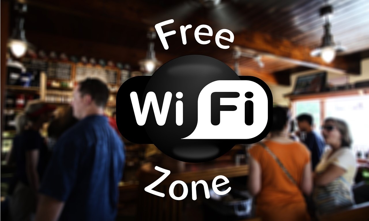 The words "Free WiFi Zone" and a photo of people in a bar.